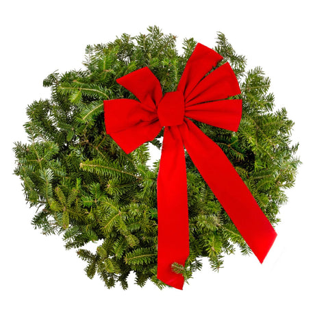 Simple Christmas wreath of fresh cut Christmas tree clippings with a large red bow.