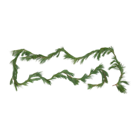 White pine garland, not decorated, simply spread out over a white backdrop showcasing its green needles and non-uniform natural appearance.